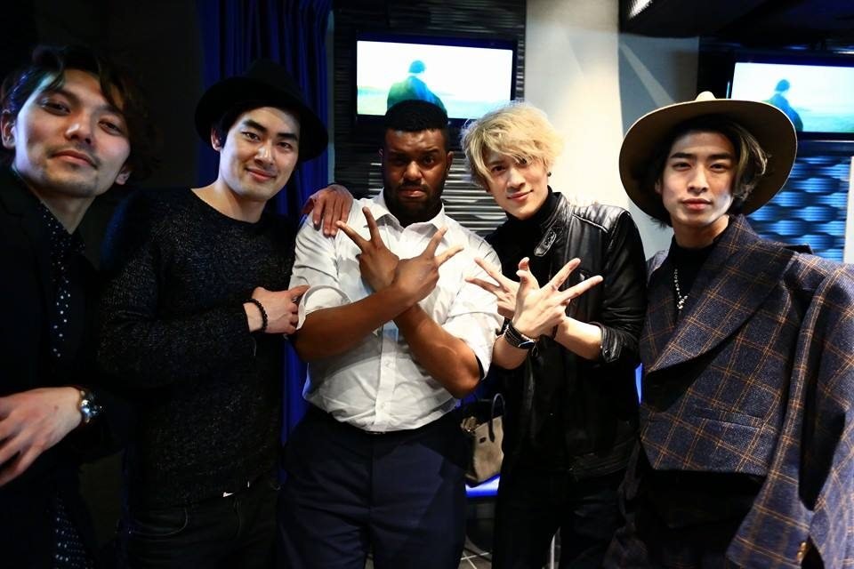Tommy with J-pop band I Don't Like Mondays on the set of their music video We Are Young